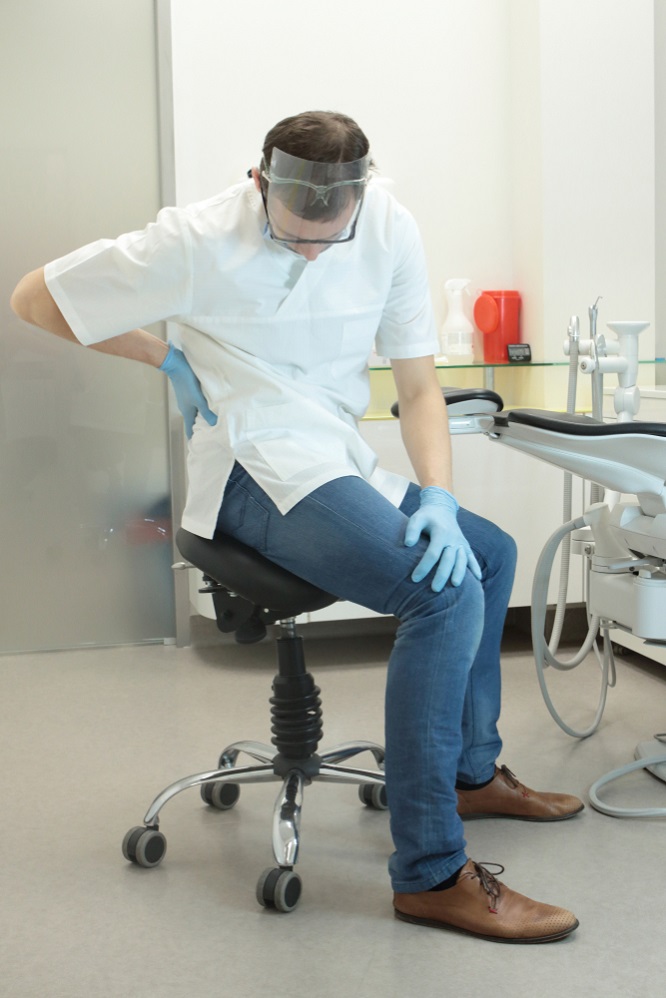 Dentist with lower back pain